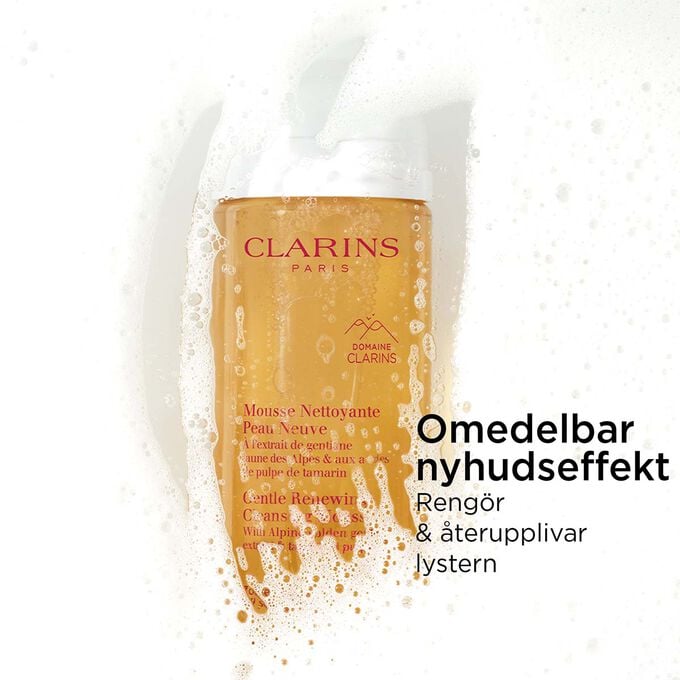 Packshot av den orange flaskan med l&ouml;ddrande ansiktsreng&ouml;ring under skum med text om dess nyhudseffekt.