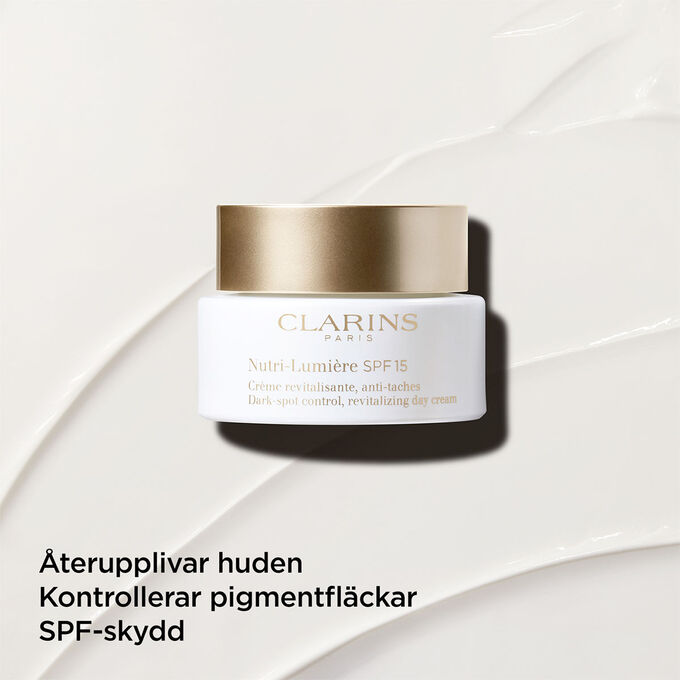 Dagkr&auml;m mot pigmentfl&auml;ckar med SPF 15 p&aring; en texturerad bakgrund som framh&auml;ver dess &aring;terupplivande effekt p&aring; huden